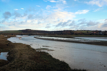 Countryside landscape of River Ader and meadow near Shoreham-by-Sea, England
