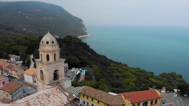 4K aerial drone video clip - View from drone flying around an old church in  Sirolo, Italy.