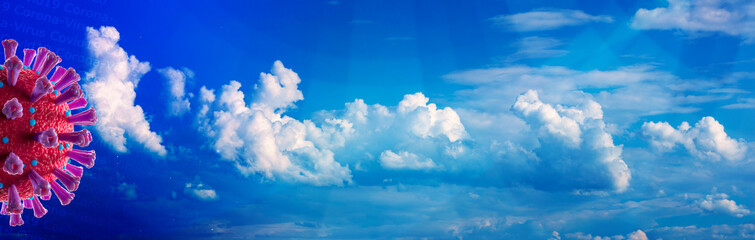 Corona-Virus (Covid 19) vor blauem Himmel mit Wolken im Hintergrund als Panorama.
