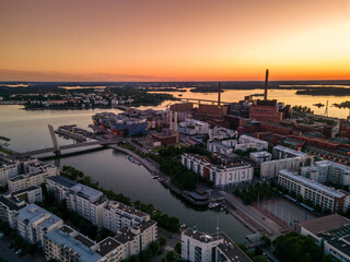 Aerial sunset view of beautiful city Helsinki . Colorful sky and colorful buildings. Helsinki, Finland.	