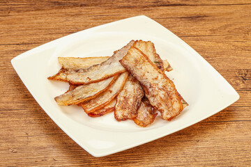 Roasted juicy bacon in the plate