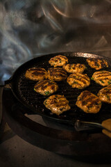 Juicy homemade meatballs from fresh meat in a grill pan. Closeup