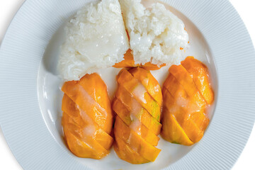 Yellow ripe mangoes eaten with sticky rice, deliciously sweet.