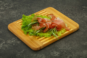 Sliced pork Jamon with rosemary