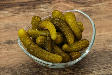 Pickled gherkin in the bowl