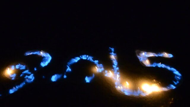 blue flames on snowy spelling 2015