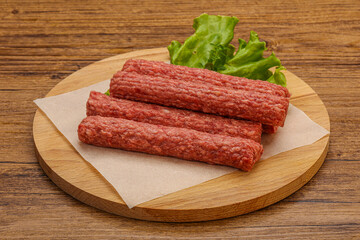 Raw beef sausages with spices
