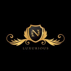 Golden N Logo Luxurious Shield logo design concept.