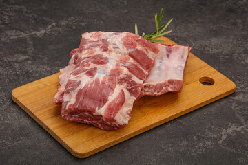 Raw pork ribs served rosemary