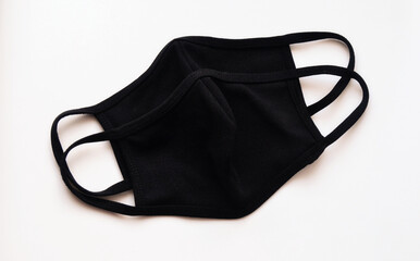 Black protective face masks against COVID-19. Made of cotton.