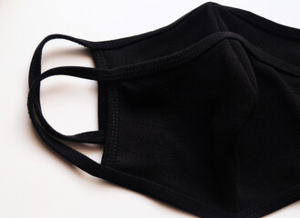 Black protective face masks against COVID-19. Made of cotton.