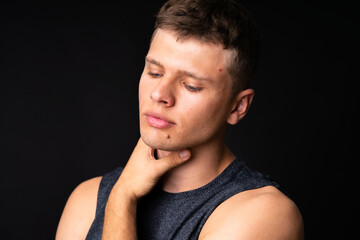 Obraz premium Portrait of young man over isolated black background
