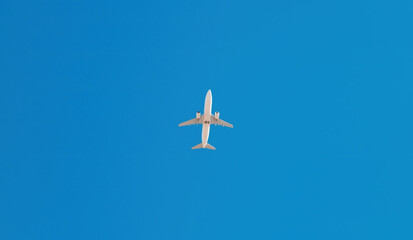 Bottom view of Passenger airplane flying overhead