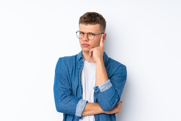 Young handsome man over isolated white background with glasses