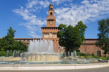 view of Sforzesco Castle, Milan, Italy against blue sky.