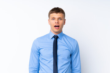 Young handsome businessman with surprise facial expression