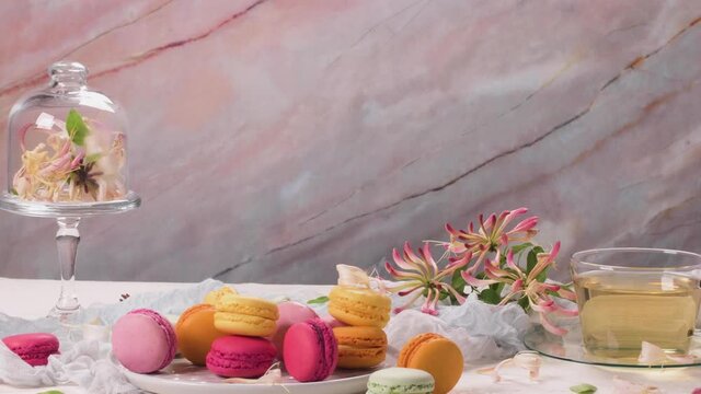 A french sweet delicacy, macaroons variety closeup. Color fresh macaroons on wooden background.