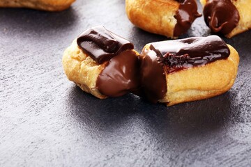 Traditional French dessert. Eclair with chocolate icing. Pastery dessert concept
