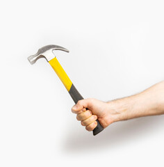 hammer in male hands on a white background. close-up.