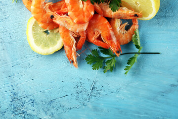 Raw fresh Prawns Langostino Austral. shrimp seafood with fresh lemon and spices.