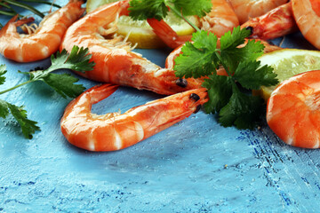 Raw fresh Prawns Langostino Austral. shrimp seafood with fresh lemon and spices.