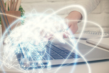 Double exposure of woman hands typing on computer and business theme hologram drawing. Success concept.