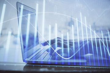 Double exposure of woman hands typing on computer and forex chart hologram drawing. Stock market analysis concept.