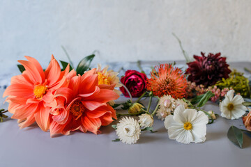 Fototapeta premium Nice floral background with garden flowers. Bouquet preparation. Close up