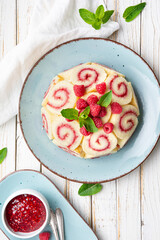 Charlotte royale cake filled with raspberry jam and decorated with fresh berries