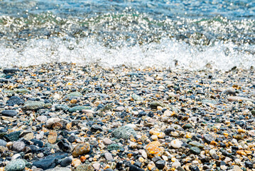 Pebbles in the water edge of a beach