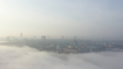 Fototapeta na wymiar Aerial view of the city in the fog.