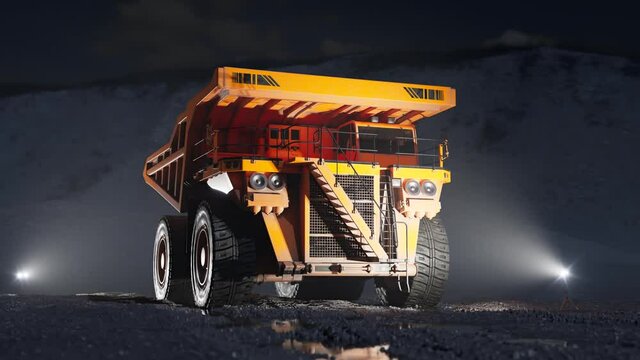 Epic, yellow big dump truck standing in the quarry during the night. 4KHD