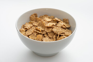 Bowl of whole grain muesli isolated on the white background.