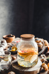 Hot tea with slices of fresh grapefruit on wooden tablet. Healthy drink, Eco, vegan