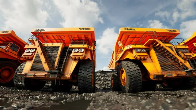 An endless row of big dump trucks. Fleet ready for heavy transport. 4KHD