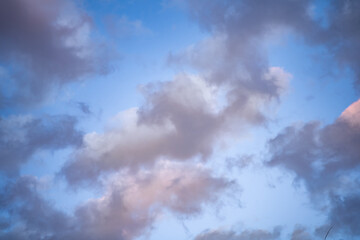 Cloudy blue sky with grey and white clouds