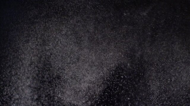 Water spray droplets snow falling on black texture effect