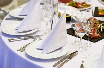 Table set for the celebration and reception of guests in the restaurant winter table setting at a...