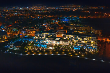 Fototapeta premium Cyprus, Paphos embankment with illumination, aerial view at night. Famous mediterranean resort city. Summer Travel.