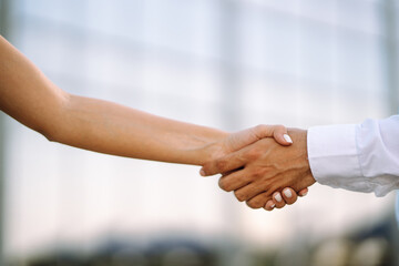 Obraz na płótnie Canvas Handshake of business partners after a favorable deal relationships to achieve future commercial and investment goals.