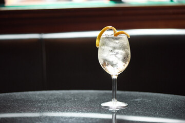 Cocktail with Lemon Twist Garnish on Restaurant Table