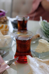 a family having breakfast, a cup of black hot tea at breakfast,