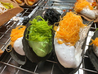 Kanom Bueang is an ancient Thai dessert known as crispy pancakes in English. It is a popular form of street food in Thailand.