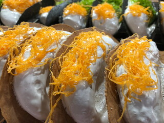 Kanom Bueang is an ancient Thai dessert known as crispy pancakes in English. It is a popular form of street food in Thailand.