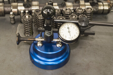Obraz na płótnie Canvas Checking the internal combustion engine valve stem