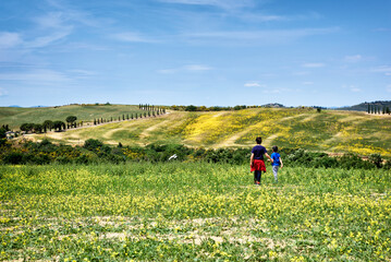 Fototapeta premium young woman walking in the field