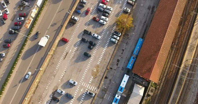 Bird-eye aerial over city suburbs parking lot