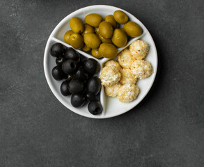 Black and green marinated olives with cheese balls