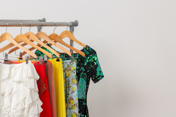 Rental fashion clothes concept. Festive clothes on the rail. Fashion blog, website, social media hero header.