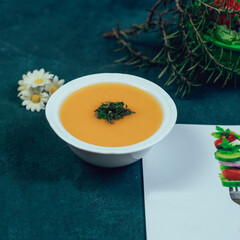 Lentil soup served with minced herbs